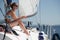 Young woman on deck of sailing yacht