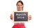 Young woman in a dirndl holding up a blank slate