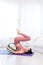 Young woman do wheel yoga in a bed room