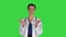 Young woman doctor clapping hands on a green screen, chroma key.