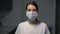 Young woman doctor or nurse. Girl in medical mask. Pandemic covid19.