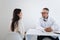 Young woman at the doctor`s appointment. Doctor giving advices to female patient.