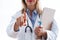 Young woman doctor selecting something blank with the finger to the camera over white background