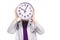 Young woman doctor with stethoscope in trouble holding clock in front of her head in white uniform on white background