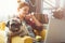 Young woman and dog with laptop . Work at home. Pug