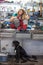 Young woman and dog in a mechanic shop