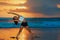 Young woman doing exercise on beach