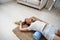 Young woman doing exercise with gymnastic roll on the floor at home