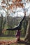 young woman doing headstand pose outdoors