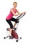 Young woman doing indoor biking exercise