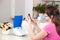 Young woman doing inhalation with a nebulizer at home