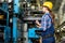 Young Woman Doing Inventory at Modern Plant