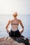 Young Woman doing Lotus Yoga Position