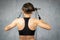 Young woman doing a toning exercise with pulley