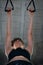 Young woman doing a toning exercise with pulley