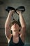 Young woman doing a toning exercise with pulley