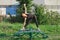 young woman doing triangle yoga pose outdoors