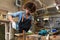 Young woman doing woodwork in a workshop