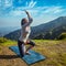 Young woman doing yoga advanced asana