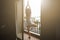 Young woman doing yoga on balcony hotel sunset time