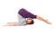 Young woman doing yoga exercise Halasana (Plow Pose). Isolated o