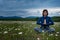 A young woman doing yoga in the field