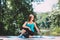 Young woman doing yoga in morning park.