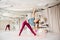 Young woman doing yoga triangle pose at studio