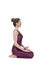 Young woman doing yoga in Vajrasana pose