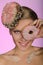 Young woman, donut on head and front of eye