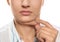 Young woman with double chin on white background