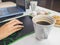 A young woman drank a glass of coffee accompanied by snacks during breaks during work time