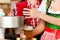 Young woman drawing beer in restaurant or pub