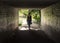 Young woman in dress, walking through a tunnel