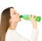 Young woman drink a water from bottle