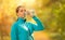 Young woman drinking fresh water during her fitness exercise