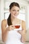 Young Woman Drinking Herbal Tea