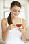 Young Woman Drinking Herbal Tea