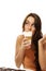 Young woman drinking latte macchiato coffee lookin
