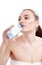 Young woman drinking mineral water bottle.