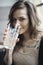 Young Woman Drinking a Pint Glass of Ice Water