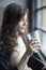 Young Woman Drinking a Pint Glass of Ice Water