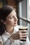 Young Woman Drinking a Pint of Stout