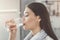 Young woman drinking pure glass of water