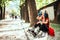 Young woman drinking water after rollerblading exercise