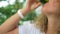 Young Woman Drinking Wheatgrass Juice. Healthy Green Raw Vegan Smoothie is the Best Source of Vitamins.