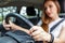 Young woman driving car on the road