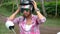 Young woman driving scooter in tropical country