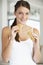 Young Woman Eating Brown Bread Roll