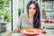 Young woman eating chinese food in a restaurant, having her lunch break